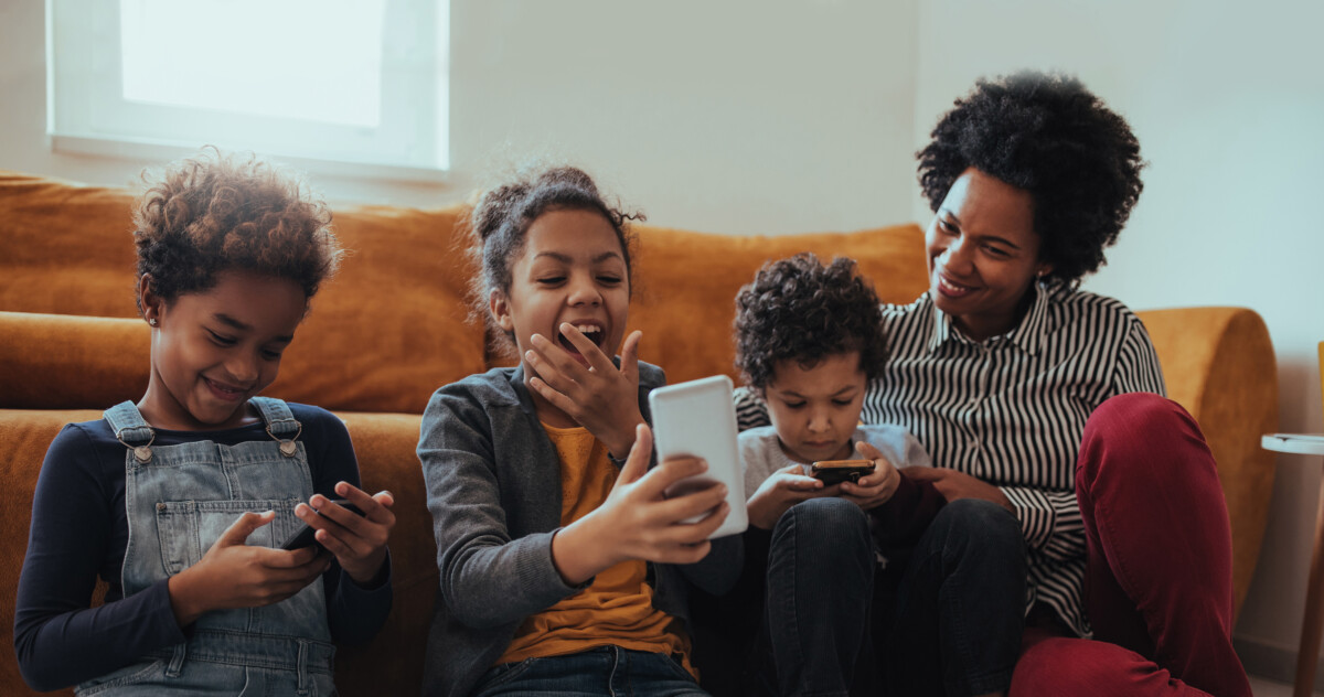 Woman playing with her smiling children