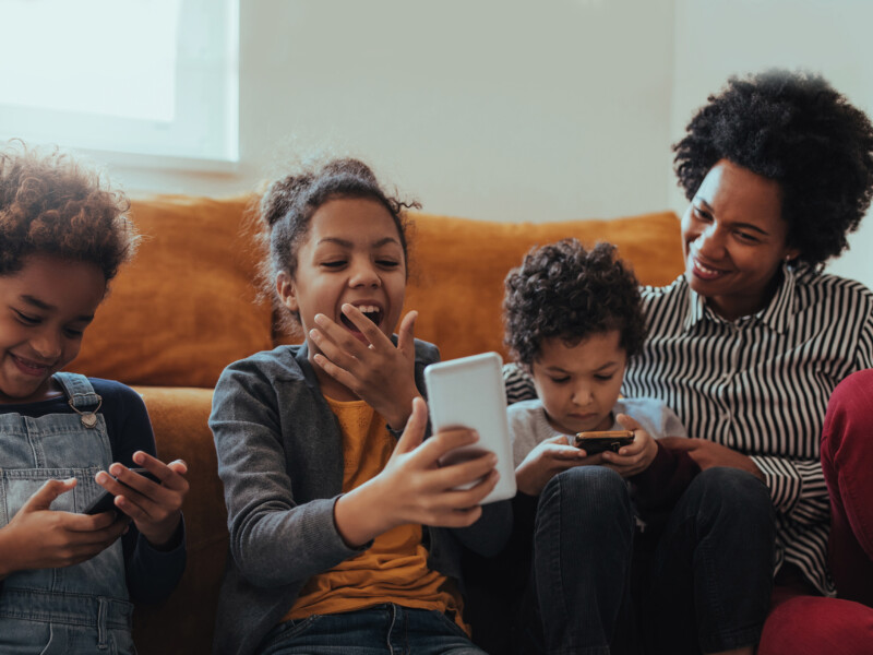 Woman playing with her smiling children