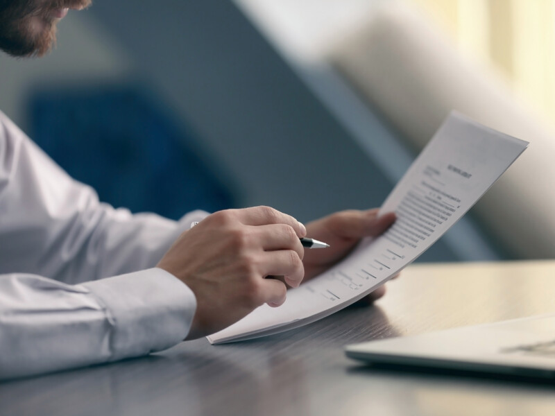 Business man reviewing corporate business documents